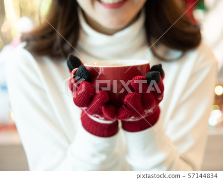 Asian woman wear white clothes and red gloves 57144834