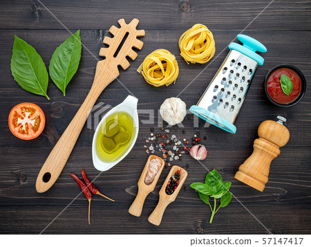 The pasta on black wooden background. Yellow The pasta on black wooden background. Yellow 57147417