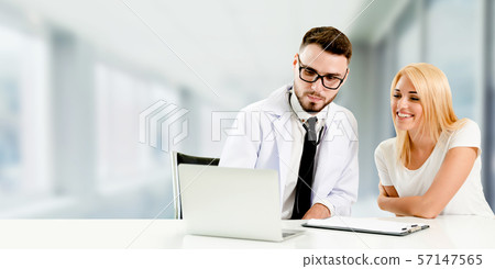 Doctor talking to patient in the hospital. 57147565