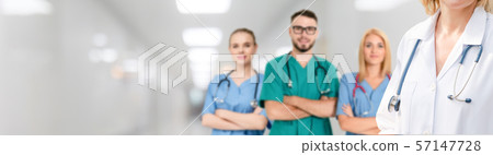Doctor working in hospital with other doctors. 57147728
