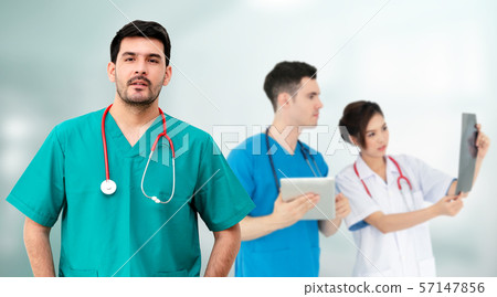 Doctor working in hospital with other doctors. 57147856
