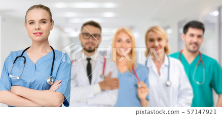Doctor working in hospital with other doctors. Doctor working in hospital with other doctors. 57147921