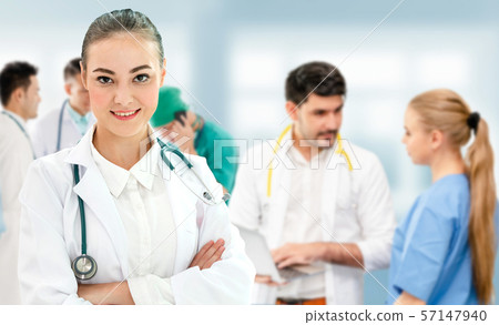 Doctor working in hospital with other doctors. 57147940
