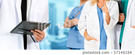 Doctor working in hospital with other doctors. Doctor working in hospital with other doctors. 57148184