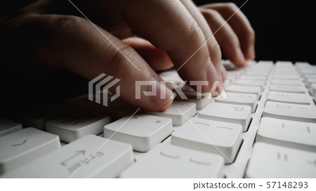 Close-up soft-focus finger typing on keyboard. Close-up soft-focus finger typing on keyboard. 57148293