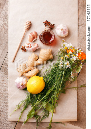 Honey in a glass jar with camomile calendula Honey in a glass jar with camomile calendula 57148525