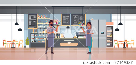 waiters couple holding serving trays with cocktails man woman restaurant workers in uniform carrying 57149387