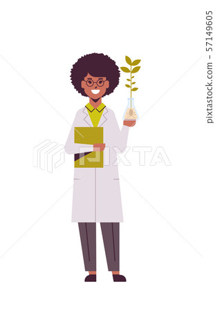 female scientist examining plant sample in test tube african american woman with clipboard in 57149605