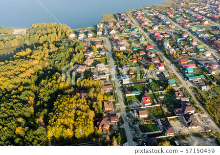 Aerial view onto rural street in autumn. Russia Aerial view onto rural street in autumn. Russia 57150439