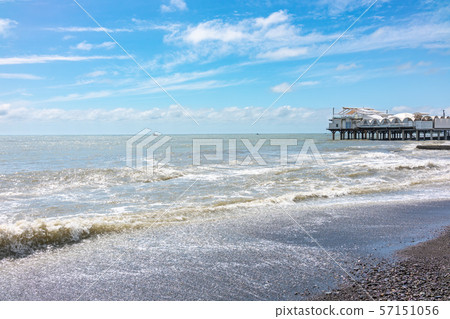 Platform on supports in the sea near the shore. Platform on supports in the sea near the shore. 57151056