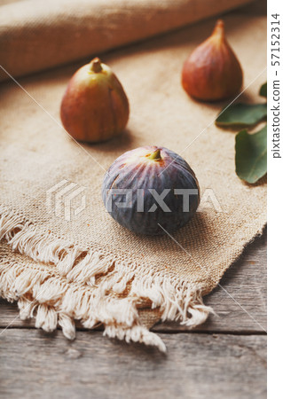Figs on the table, group of fruits on a wooden Figs on the table, group of fruits on a wooden 57152314