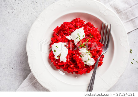 Pink beetroot risotto with feta cheese Pink beetroot risotto with feta cheese 57154151