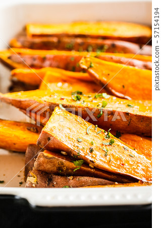 Baked sweet potato slices with spices  57154194