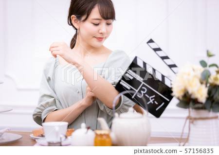 Actress filming clapperboard 57156835
