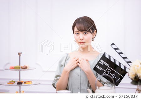 Actress filming clapperboard 57156837