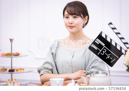 Actress filming clapperboard Actress filming clapperboard 57156838