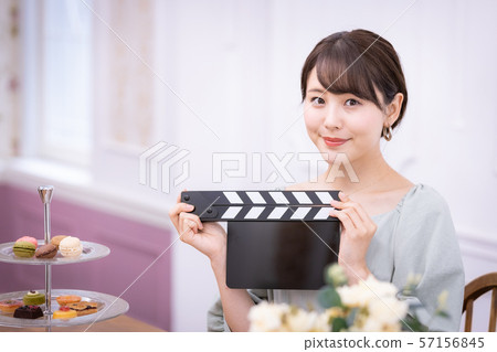 Actress filming clapperboard 57156845