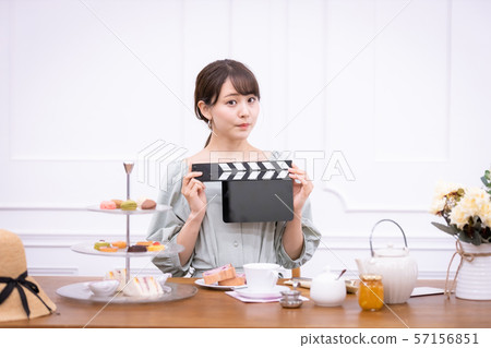 Actress filming clapperboard Actress filming clapperboard 57156851