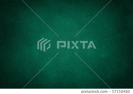 Dark green matt suede fabric closeup. Velvet Dark green matt suede fabric closeup. Velvet 57158480