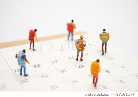 Miniature people stand on The walkway the 57161177