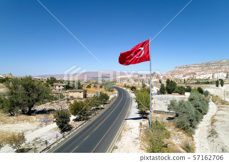 A large Turkish flag over the road to Cappadocia. A large Turkish flag over the road to Cappadocia. 57162706
