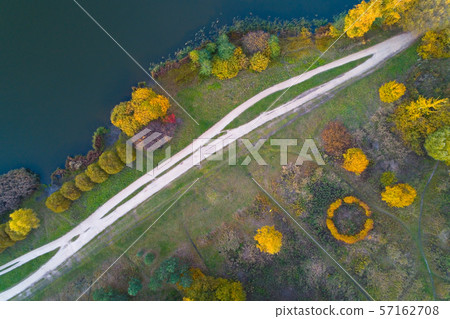 Top view of the autumn park and flower bed. Top view of the autumn park and flower bed. 57162708