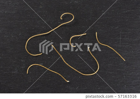 Raw thin noodles on grey stone Raw thin noodles on grey stone 57163316