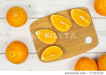 Orange minneola tangelo on grey wood 57163526