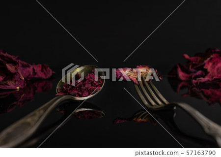 Dried red beetroot isolated on black glass 57163790