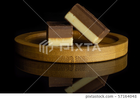 Two colours nougat isolated on black glass 57164048