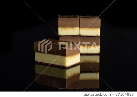Two colours nougat isolated on black glass 57164056
