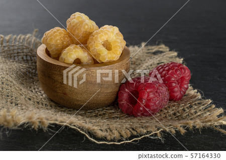 Fresh hymalayan raspberry on grey stone Fresh hymalayan raspberry on grey stone 57164330