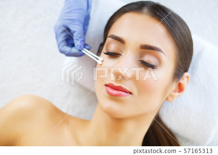 Beauty. Beautiful Woman in Beauty Salon. Relax and Lying on the Massage Tables. Clean and Fresh Skin 57165313
