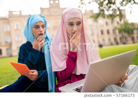 International muslim students studying before classes together 57166173