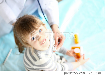 Cute kid holding vitamins Cute kid holding vitamins 57167303