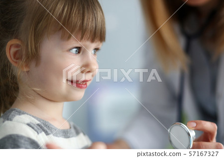 Small smiling kid on meeting with doctor Small smiling kid on meeting with doctor 57167327