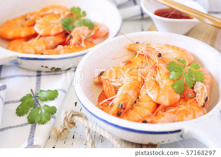 Two portions of fried shrimp and spicy red sauce 57168297
