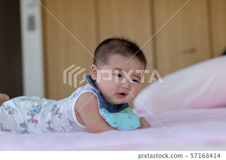 A lying baby A lying baby 57168414