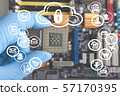 Motherboard blurred background with hand and 57170395