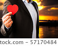 Businessman in a classic suit with an red heart on 57170484