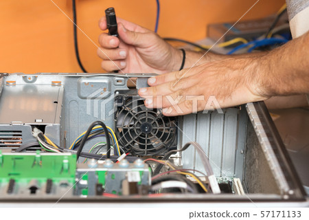 Technician repairing the computer. Concept of computer hardware, repairing, upgrade and technology. 57171133