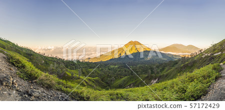 The magnificent views on green mountains from a mountain road trecking to the Ijen volcano or Kawah The magnificent views on green mountains from a mountain road trecking to the Ijen volcano or Kawah 57172429
