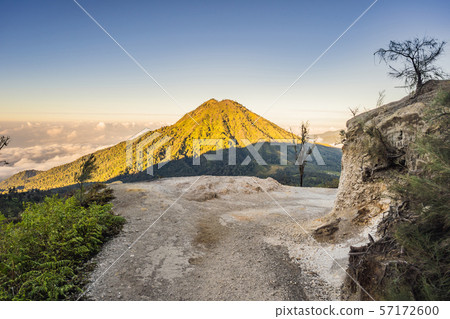 The magnificent views on green mountains from a mountain road trecking to the Ijen volcano or Kawah The magnificent views on green mountains from a mountain road trecking to the Ijen volcano or Kawah 57172600