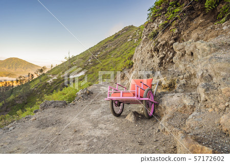 On a mountain road trecking to the Ijen volcano or Kawah Ijen on the Indonesian language. Famous On a mountain road trecking to the Ijen volcano or Kawah Ijen on the Indonesian language. Famous 57172602
