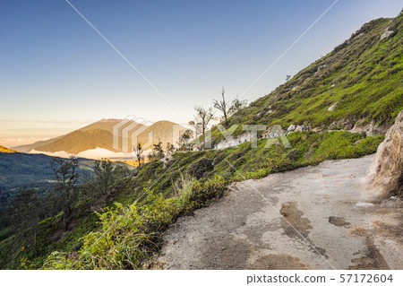 The magnificent views on green mountains from a mountain road trecking to the Ijen volcano or Kawah The magnificent views on green mountains from a mountain road trecking to the Ijen volcano or Kawah 57172604