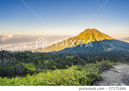 The magnificent views on green mountains from a mountain road trecking to the Ijen volcano or Kawah The magnificent views on green mountains from a mountain road trecking to the Ijen volcano or Kawah 57172866