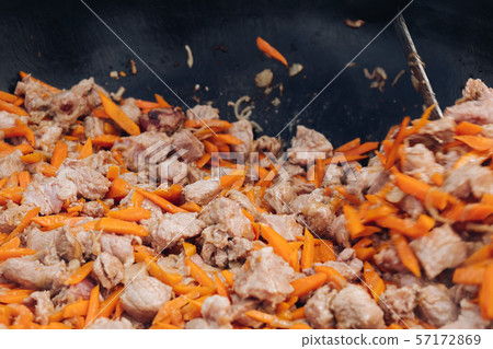 Process of cooking of delicious pilaf. Concept of 57172869