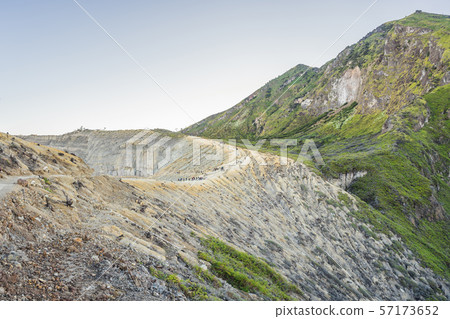 The magnificent views on green mountains from a mountain road trecking to the Ijen volcano or Kawah The magnificent views on green mountains from a mountain road trecking to the Ijen volcano or Kawah 57173652