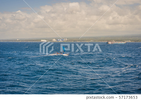Traditional east Asian sailing boat in an open sea Traditional east Asian sailing boat in an open sea 57173653