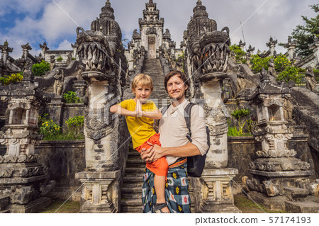Dad and son tourists on background of Three stone ladders in beautiful Pura Lempuyang Luhur temple 57174193